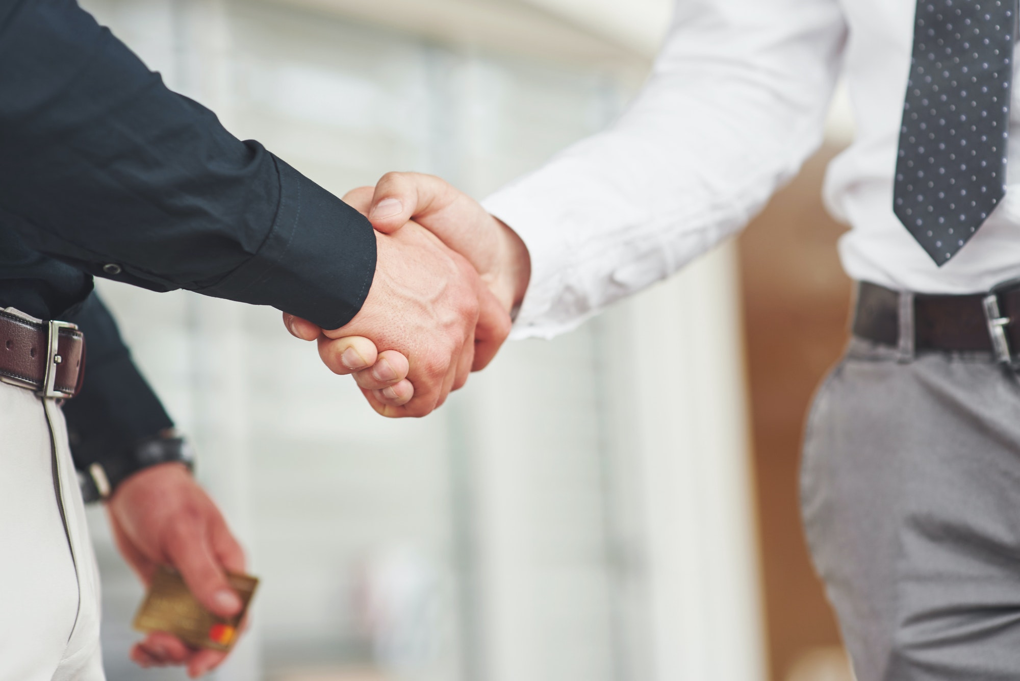 Handshake of two men. Successful business contacts after a good deal